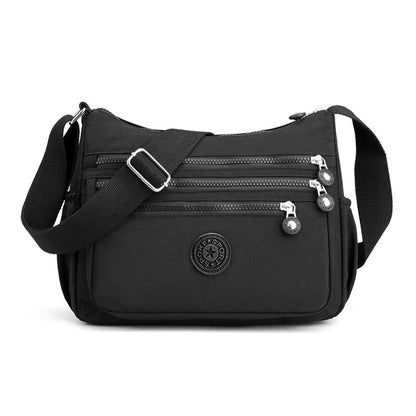 💐 -50% DE RÉDUCTION – OFFRE FLASH ! Sac à bandoulière en nylon léger avec plusieurs poches – parfait pour les voyages et l'usage quotidien 🎒⚡