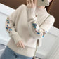 Pull en tricot épais brodé de fleurs
