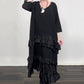 Robe fluide oversize à volants et superpositions