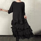 Robe fluide oversize à volants et superpositions