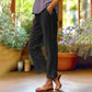 Pantalon 7/8 décontracté de couleur unie avec boutons latéraux et coupe ample