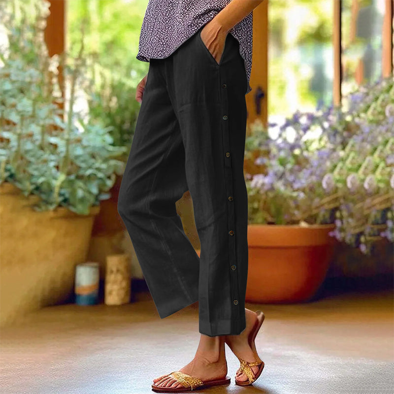 Pantalon 7/8 décontracté de couleur unie avec boutons latéraux et coupe ample