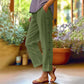 Pantalon 7/8 décontracté de couleur unie avec boutons latéraux et coupe ample