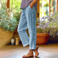 Pantalon 7/8 décontracté de couleur unie avec boutons latéraux et coupe ample