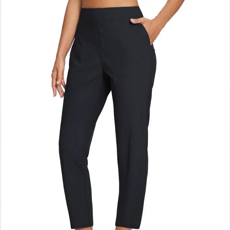 Pantalon femme taille haute extensible avec poches zippées