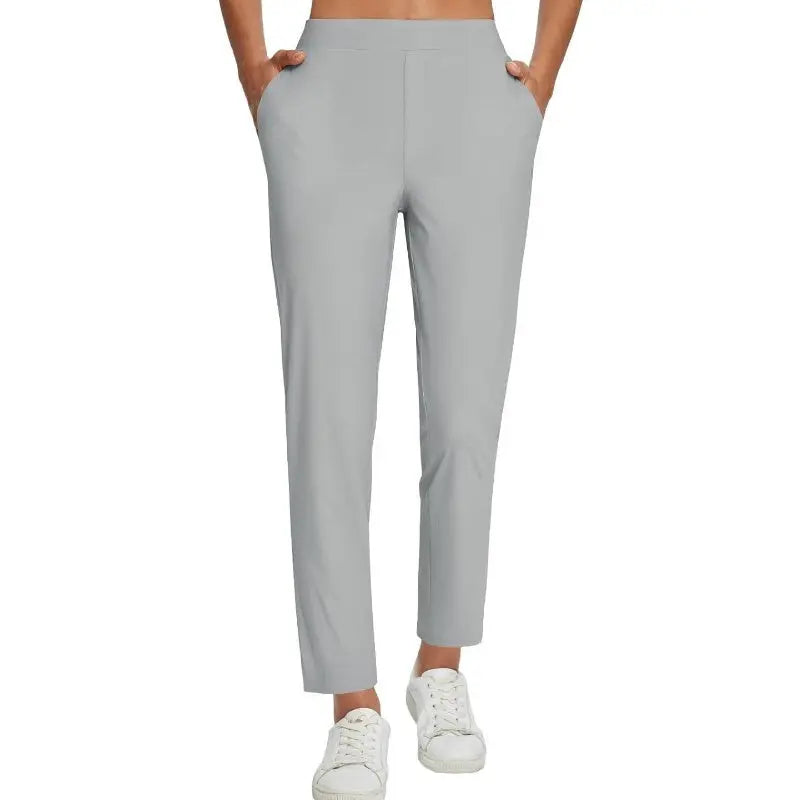 Pantalon femme taille haute extensible avec poches zippées