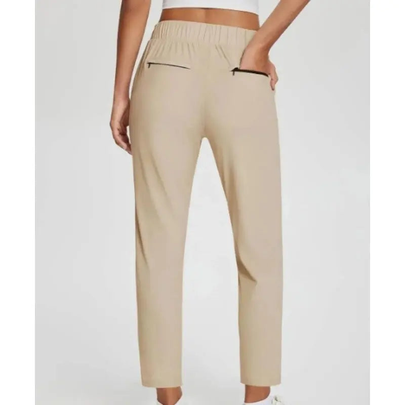 Pantalon femme taille haute extensible avec poches zippées