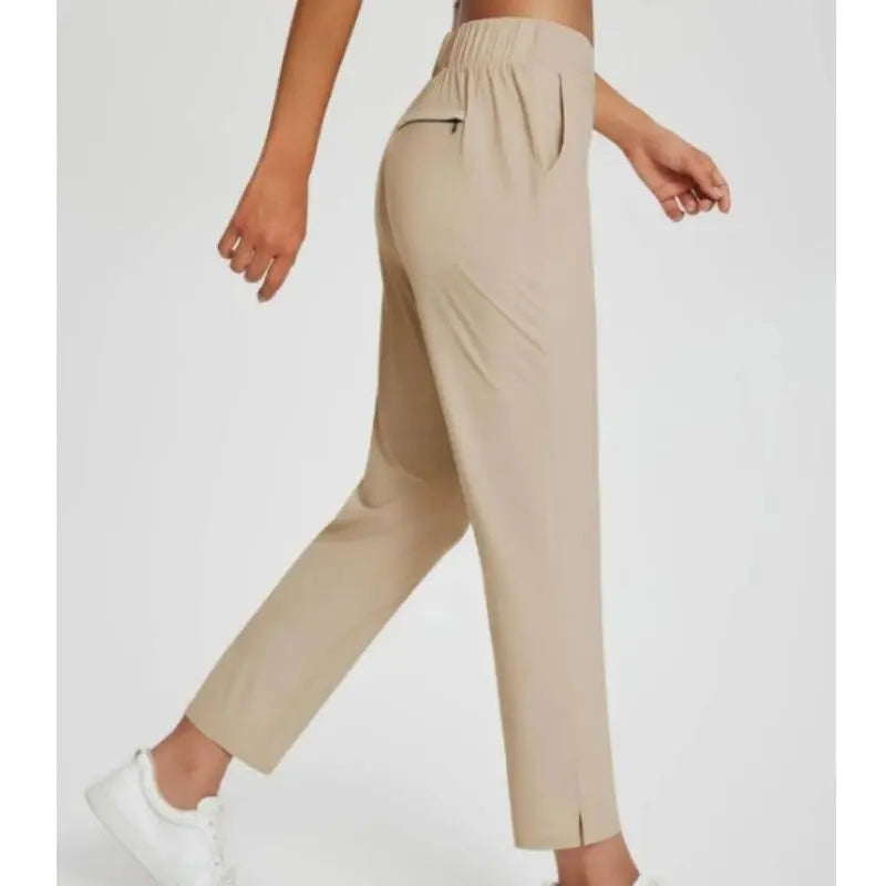 Pantalon femme taille haute extensible avec poches zippées