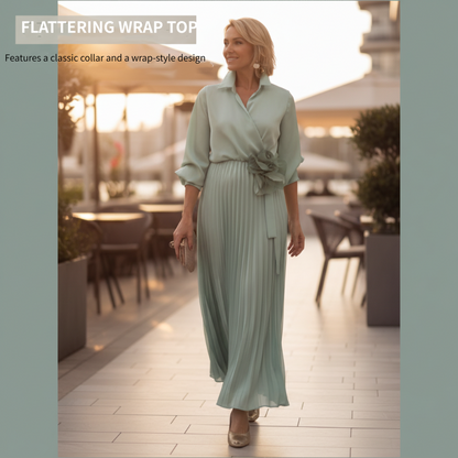 Élégante robe longue plissée avec détail floral à la taille