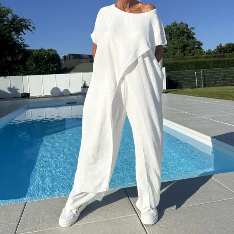 Ensemble femme composé d'un haut asymétrique à épaules dénudées et d'un pantalon